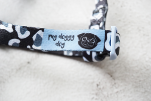 black and white leopard print dog strap harness with blue logo